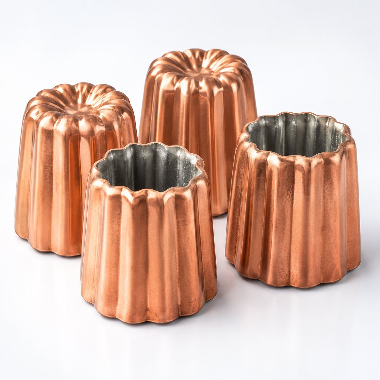 Canele Copper Moulds, 55 mm, Set of Four, shown on a plain studio background