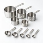 Measuring Cup and Spoon Set, Ten Pieces, shown on a plain studio background