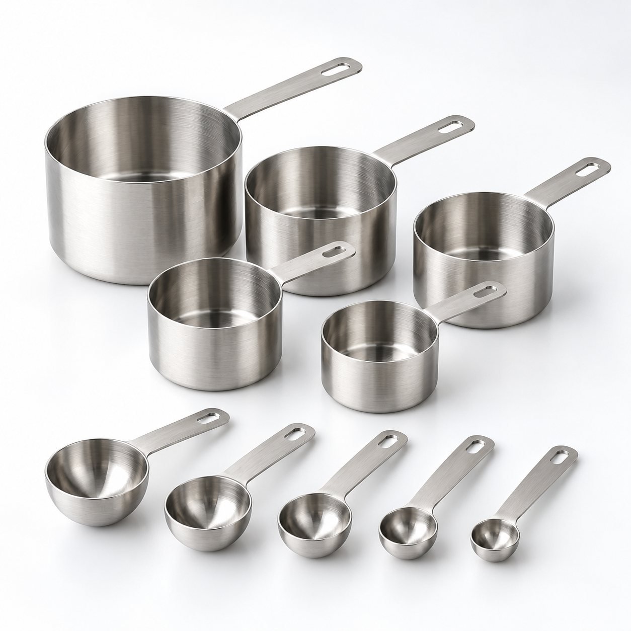 Measuring Cup and Spoon Set, Ten Pieces, shown from a low three quarter angle
