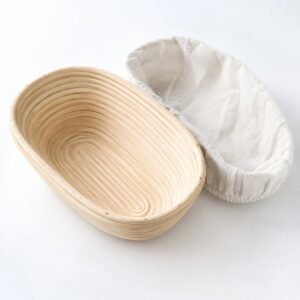 Oval Banneton Proofing Basket, 25 cm, with Liner, shown on a plain studio background