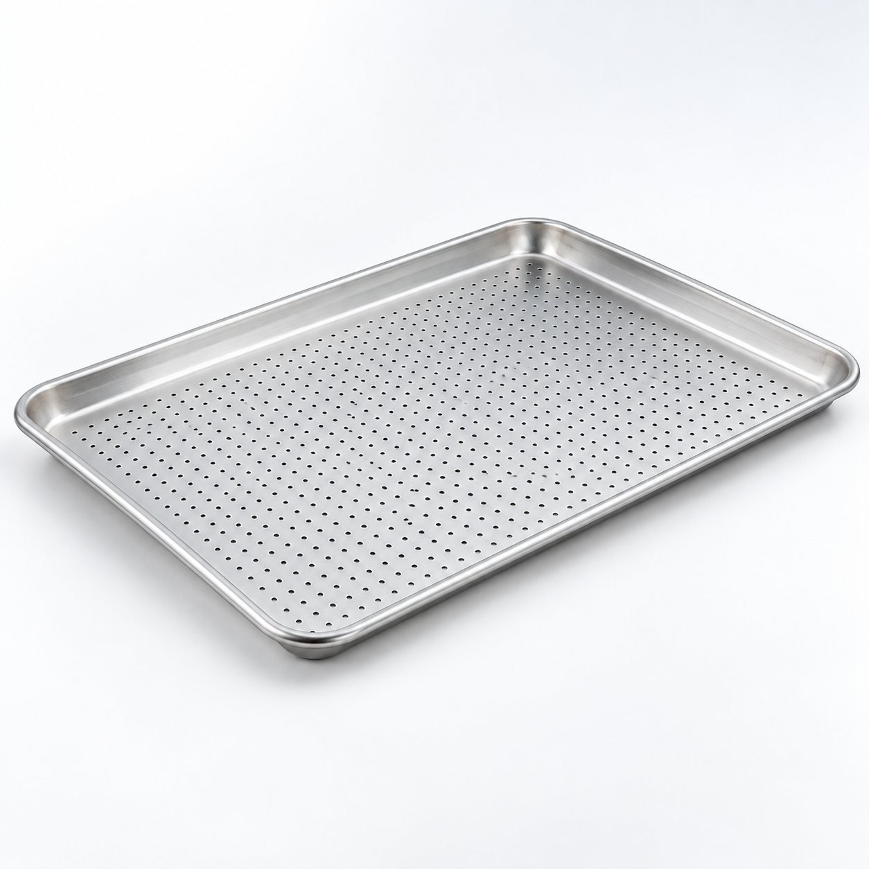Perforated Baking Sheet, 40 x 30 cm, shown from a low three quarter angle